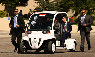 Illustration for article titled G8 Leaders Look Silly Shuttled Around In GEM Electric Cars